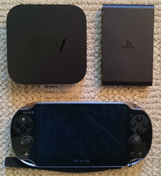 A size comparison of the PS TV (top left) with my 2012 Apple TV (top right) and my regular PS Vita.